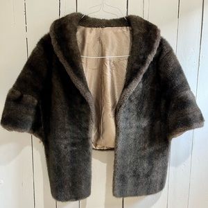 Absolutely beautiful vintage faux fur shawl. Silk lining.